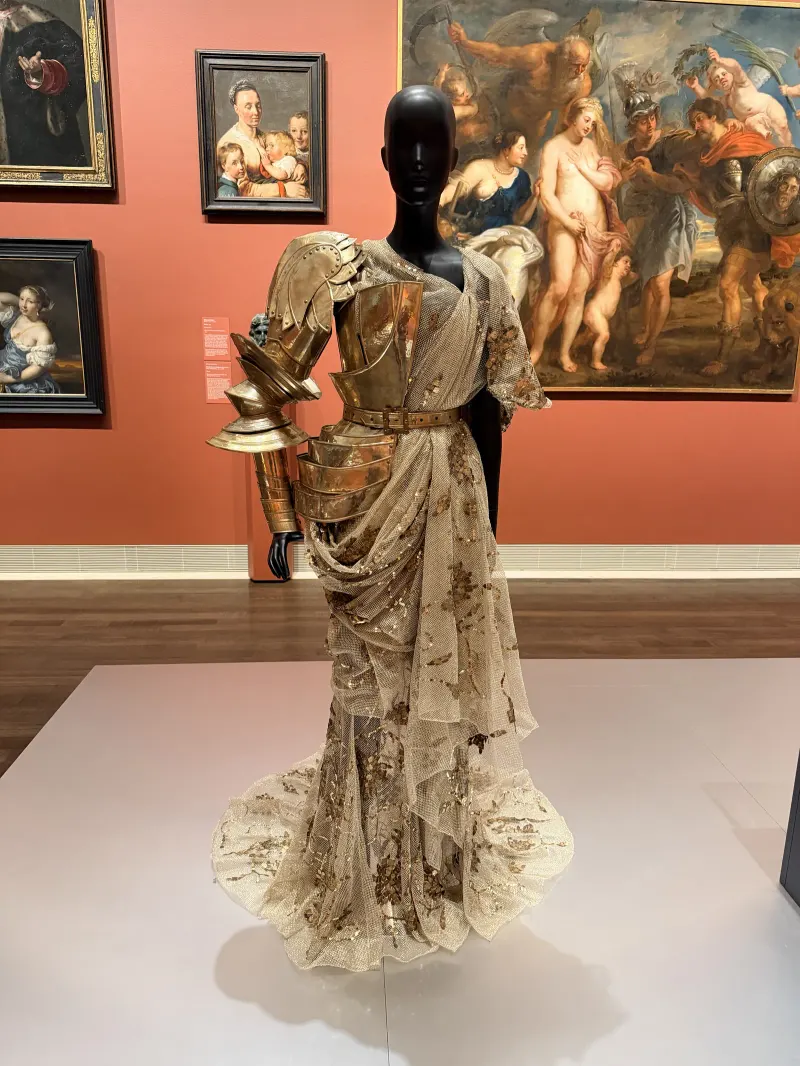 Sculptural couture in a Houston gallery — the editorial polish Clique MRKT carries through identity work